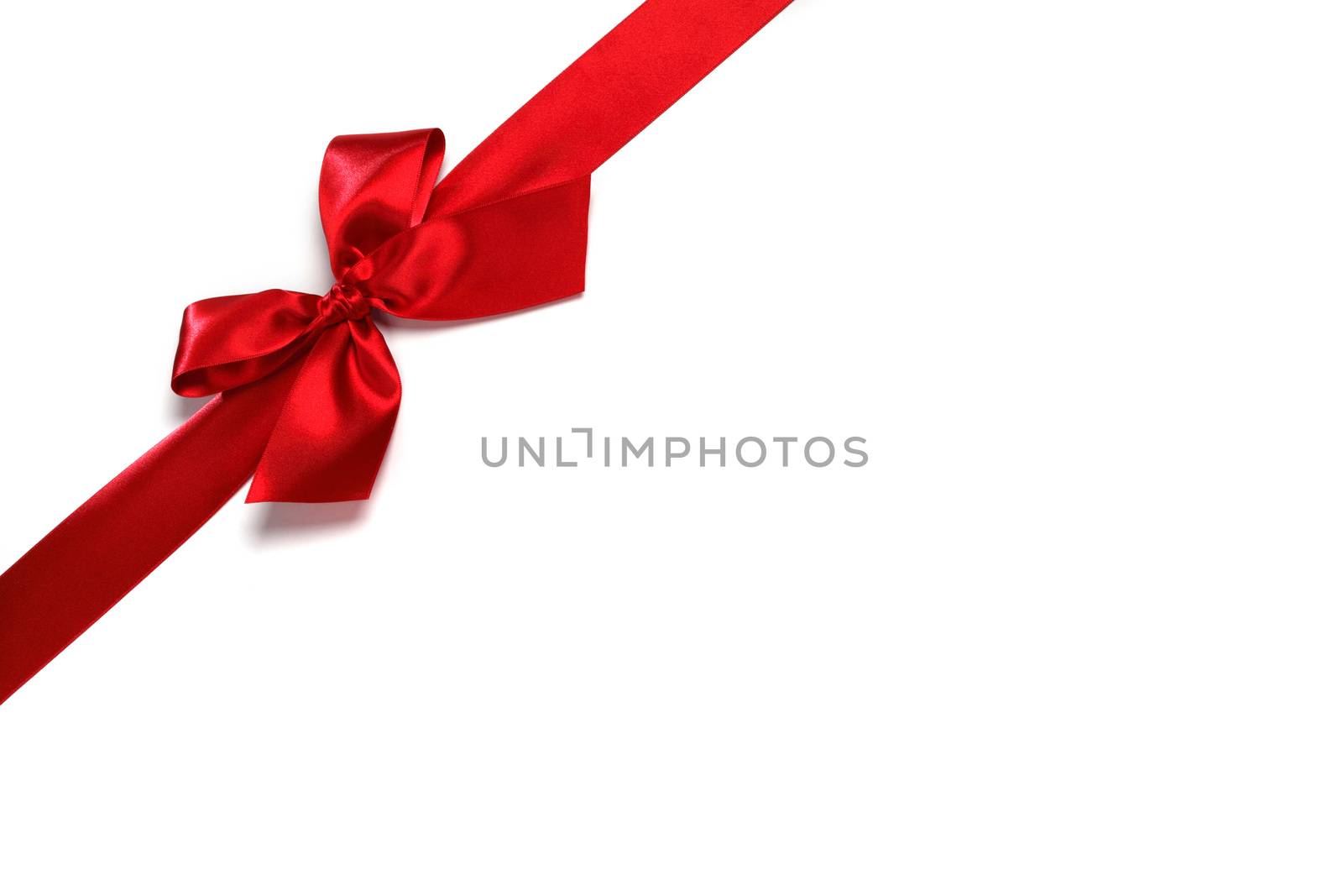 Decorative red satin bow isolated on white background