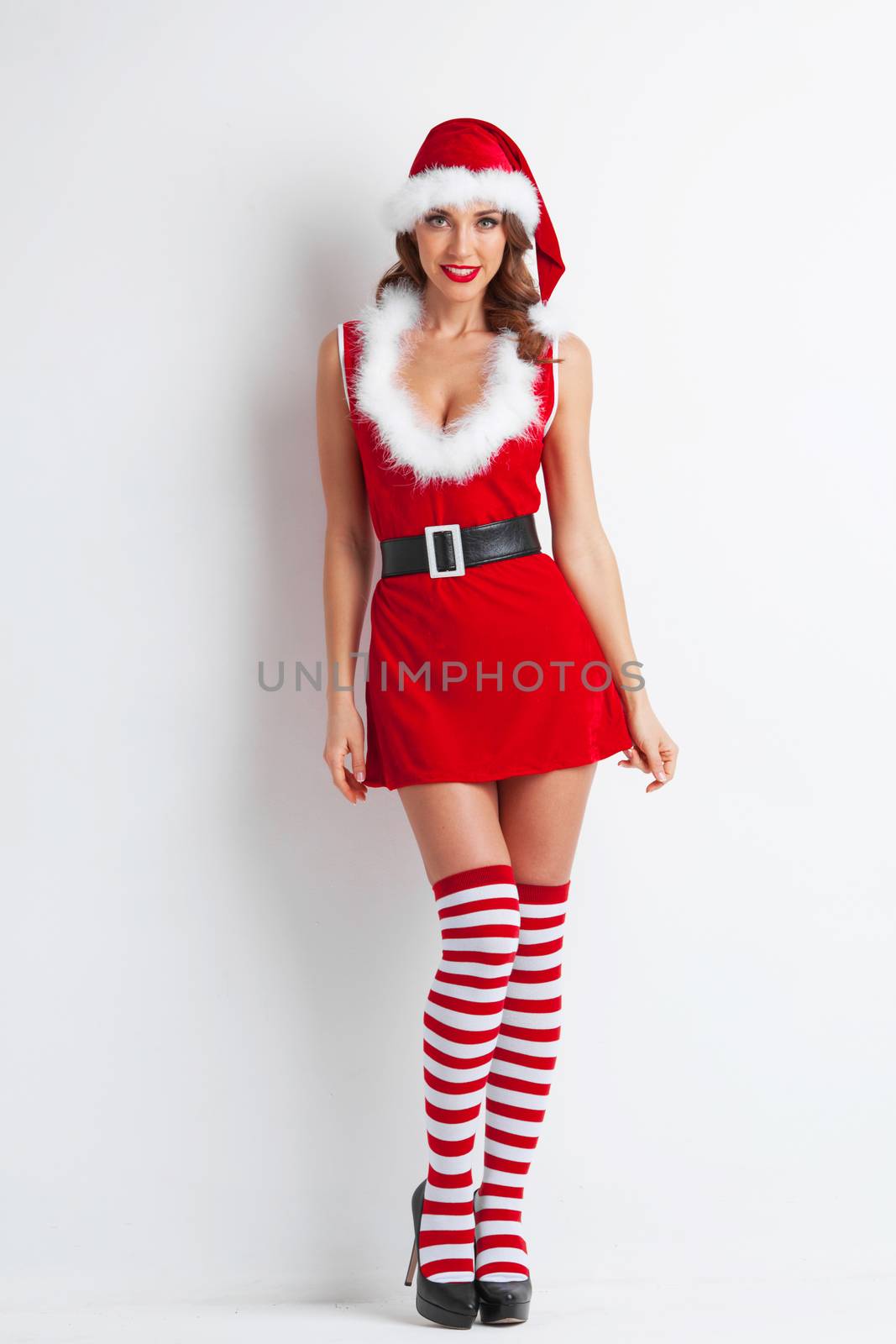 Portrait of beautiful sexy girl wearing santa claus style clothes