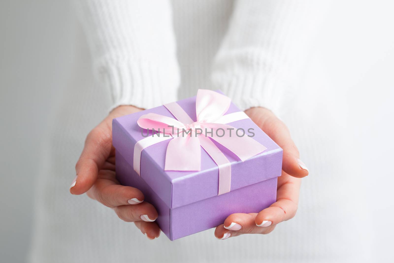 Close up gift box on woman hands . Birthday or Christmas