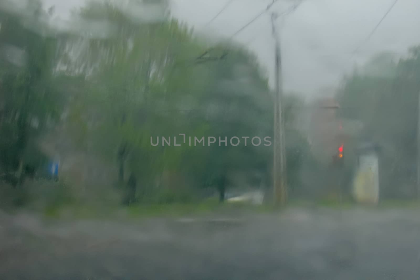 Rain drops on glass with a background.