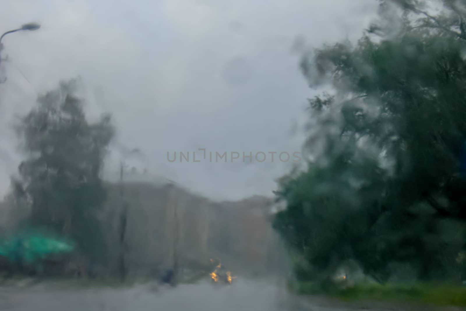 Rain drops on glass with a background.