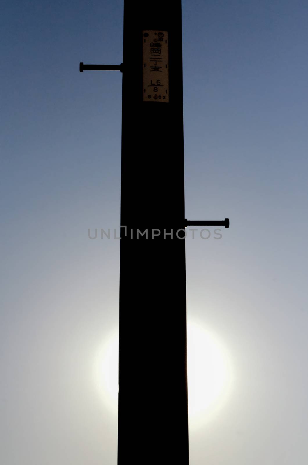 Silhouette of an electricity pole on the street of Yokohama, Japan. Yokohama is a city located in a little bit of South from Tokyo.