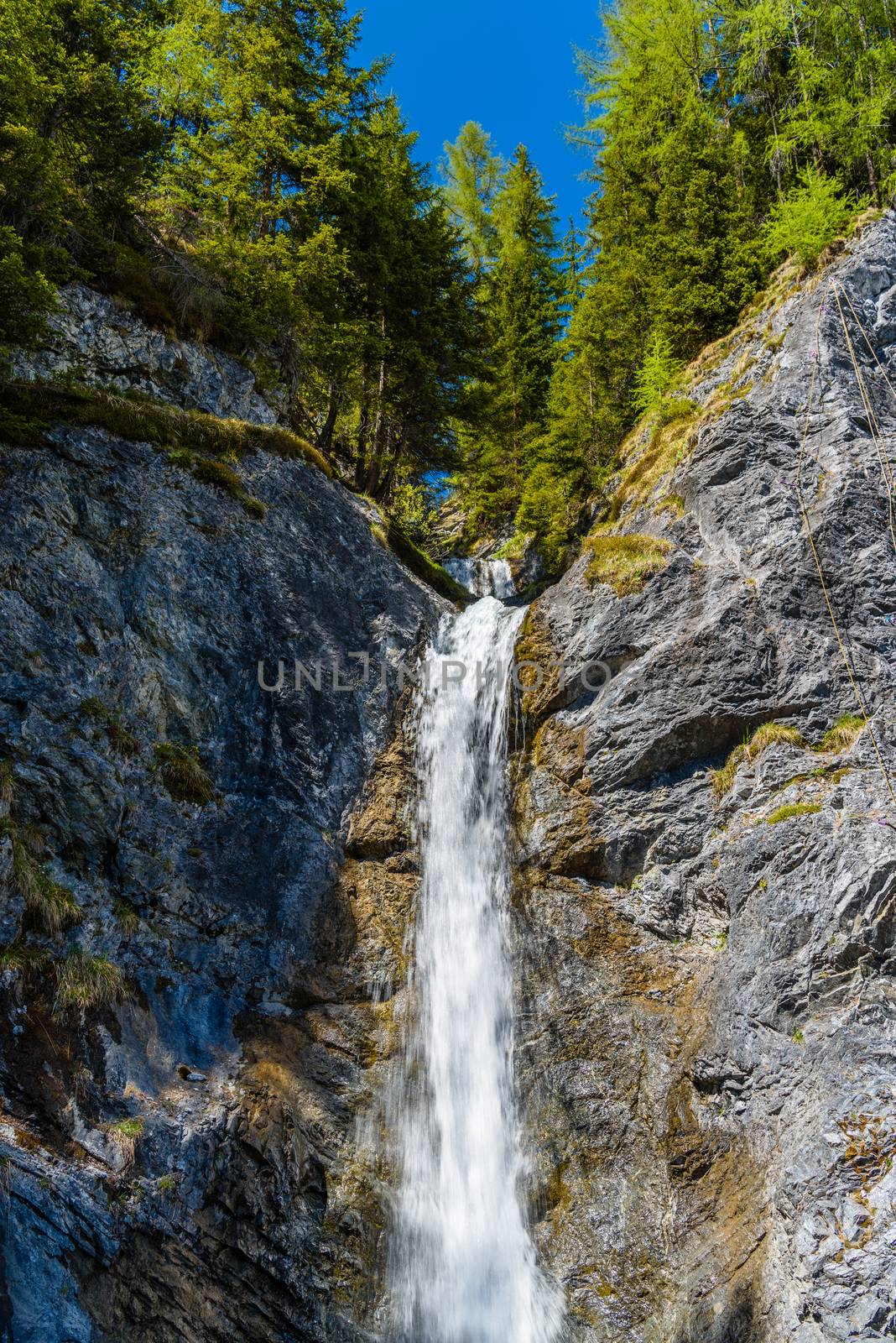 Small water fall in Alps forest, Davos,  Graubuenden, Switzerland