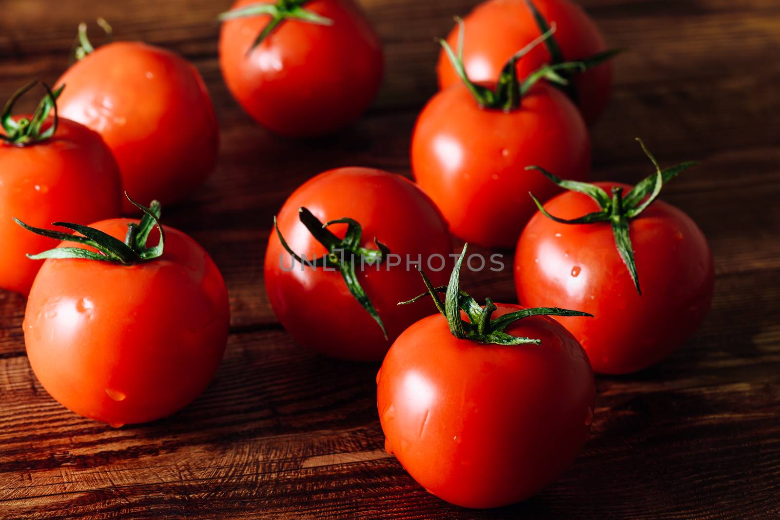 Fresh Ripe Tomatoes on Table. Close Up.