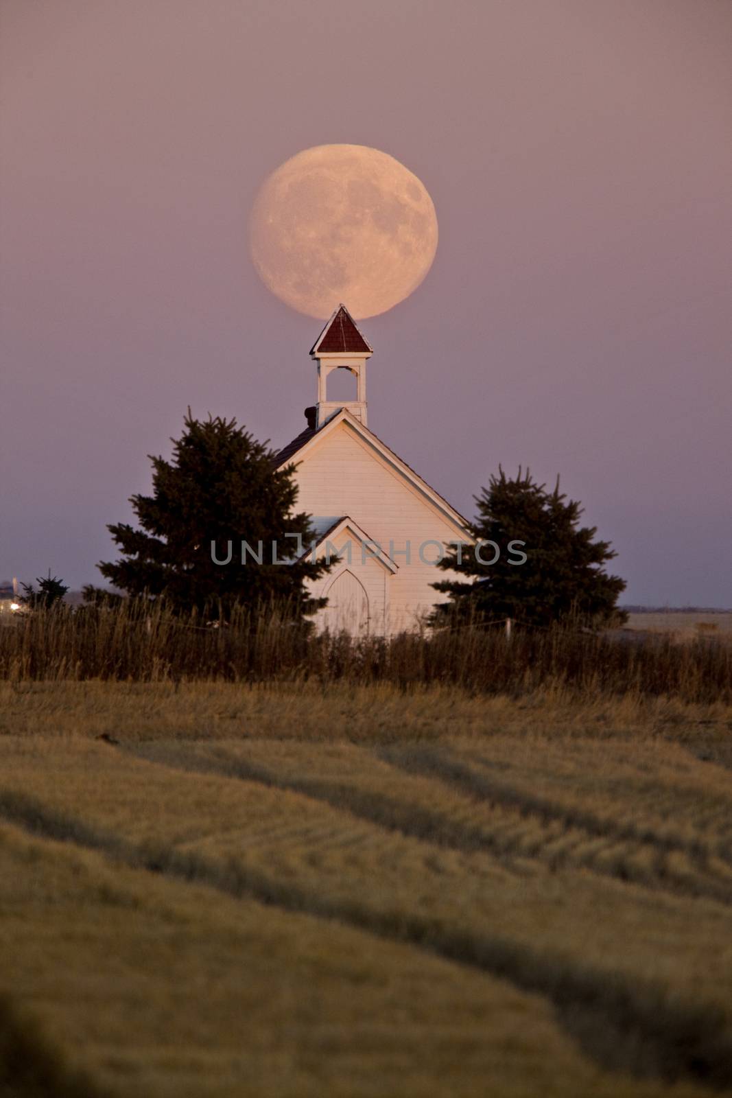 Old Country Church in Saskatchewan full harvest moon