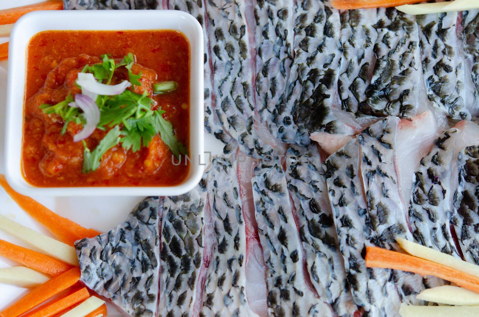 filet of raw fish served with spicy chili sauce