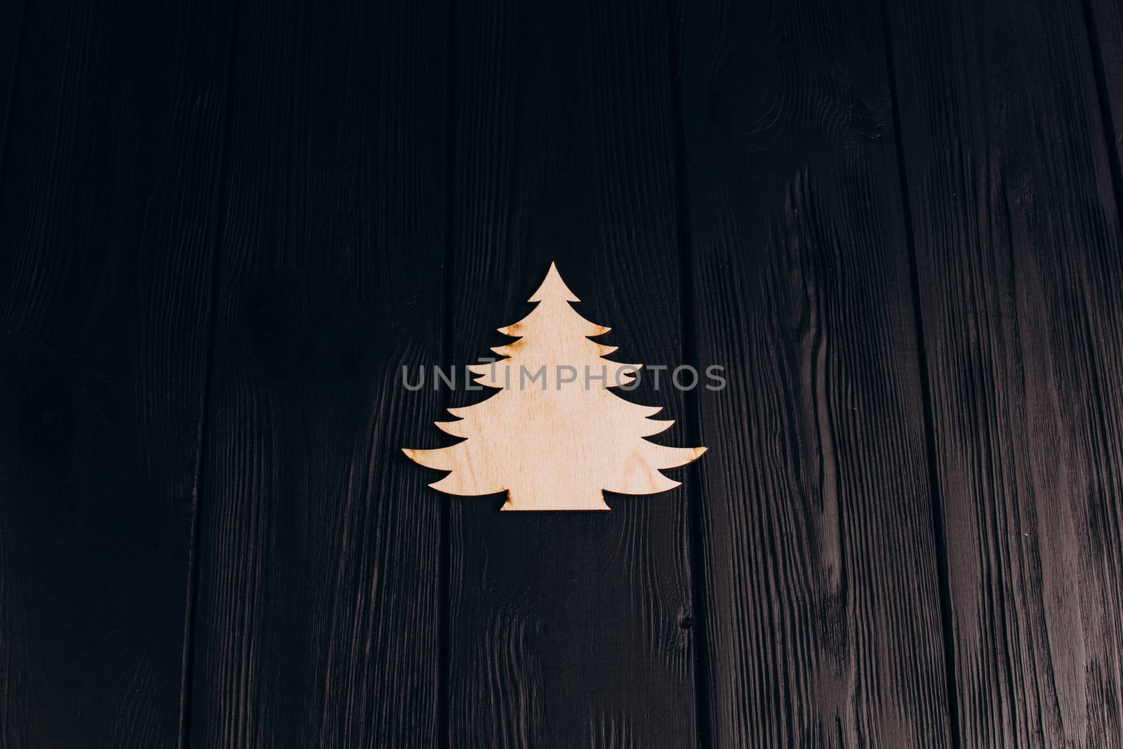 New Year composition with pine tree from plywood. Christmas background for presentation on wooden background holiday