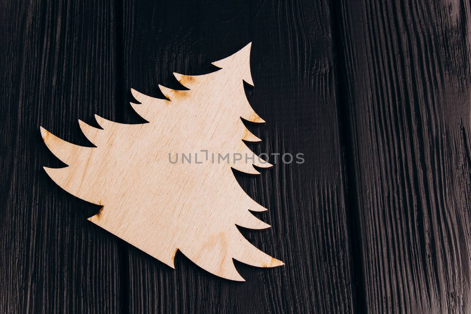 New Year composition with pine tree from plywood. Christmas background for presentation on wooden background holiday