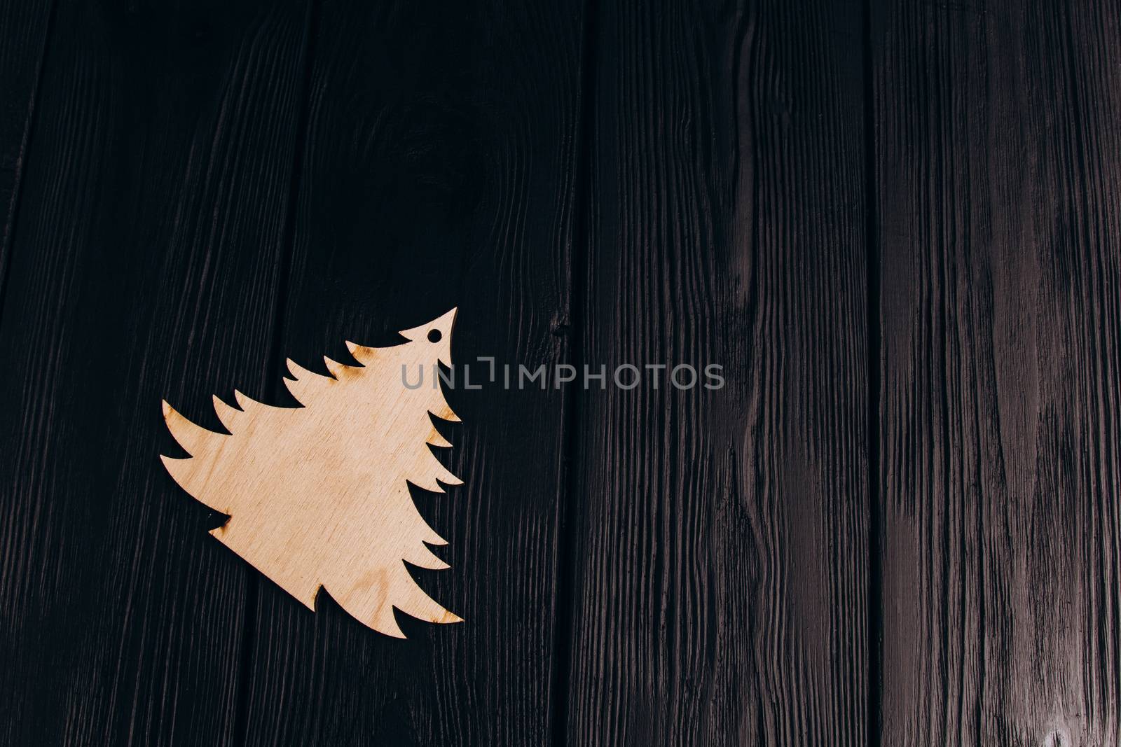 New Year composition with pine tree from plywood. Christmas background for presentation on wooden background holiday