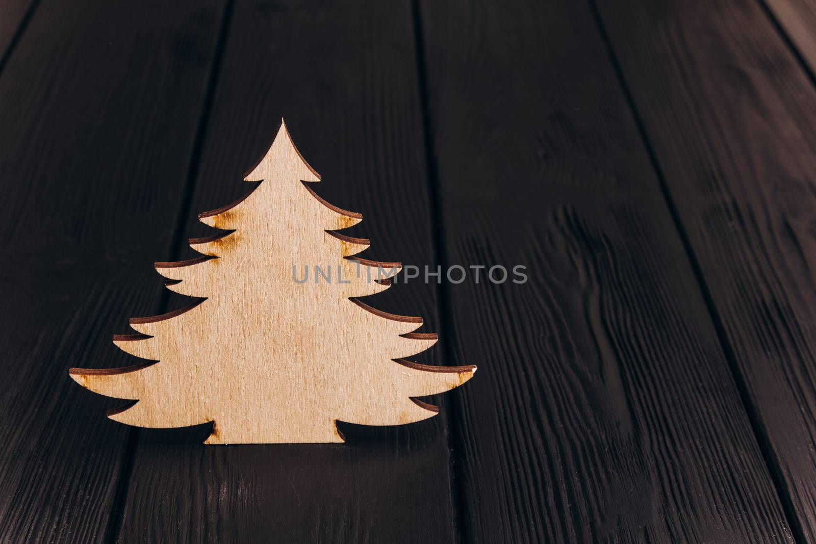 New Year composition with pine tree from plywood. Christmas background for presentation on wooden background holiday