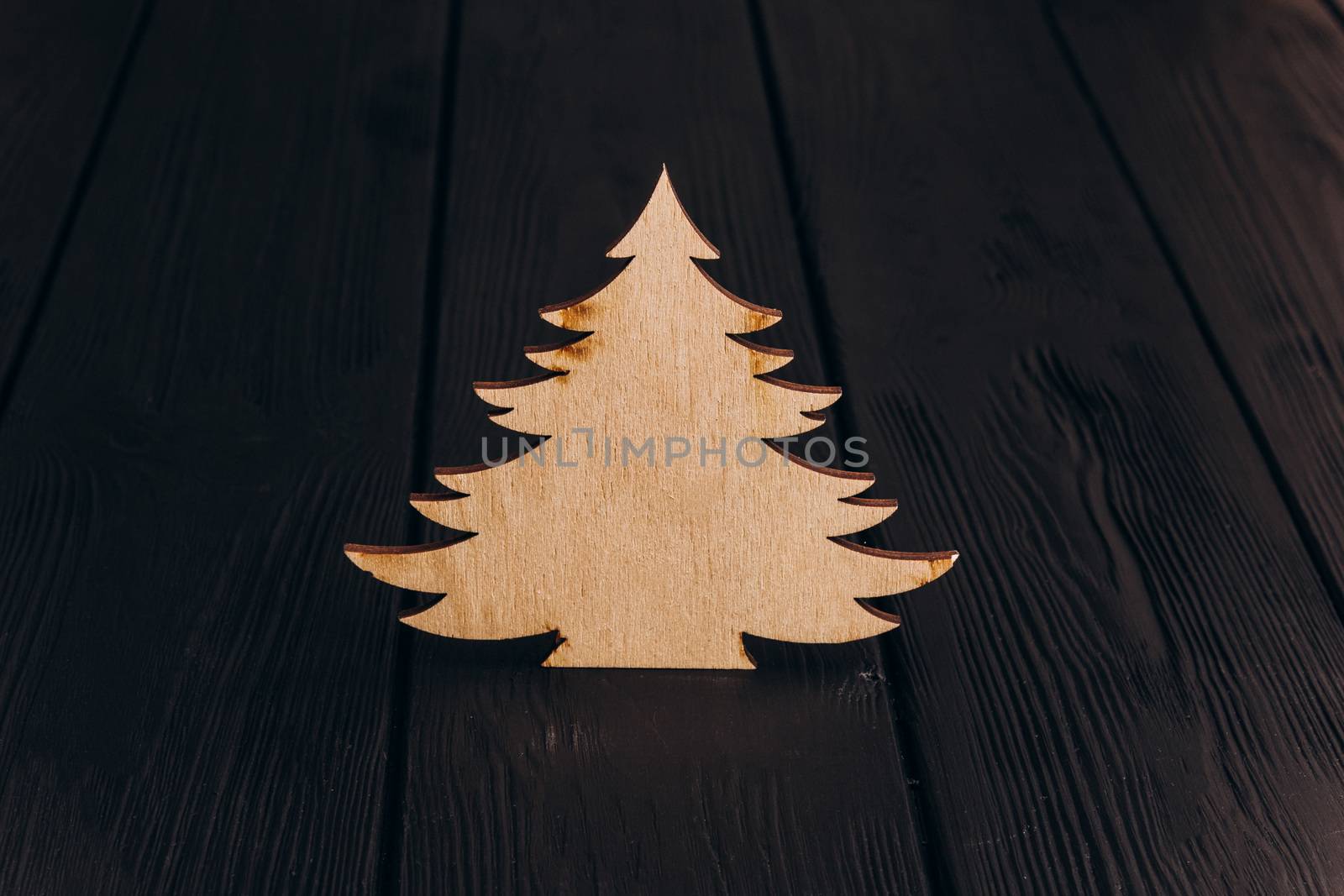 New Year composition with pine tree from plywood. Christmas background for presentation on wooden background holiday