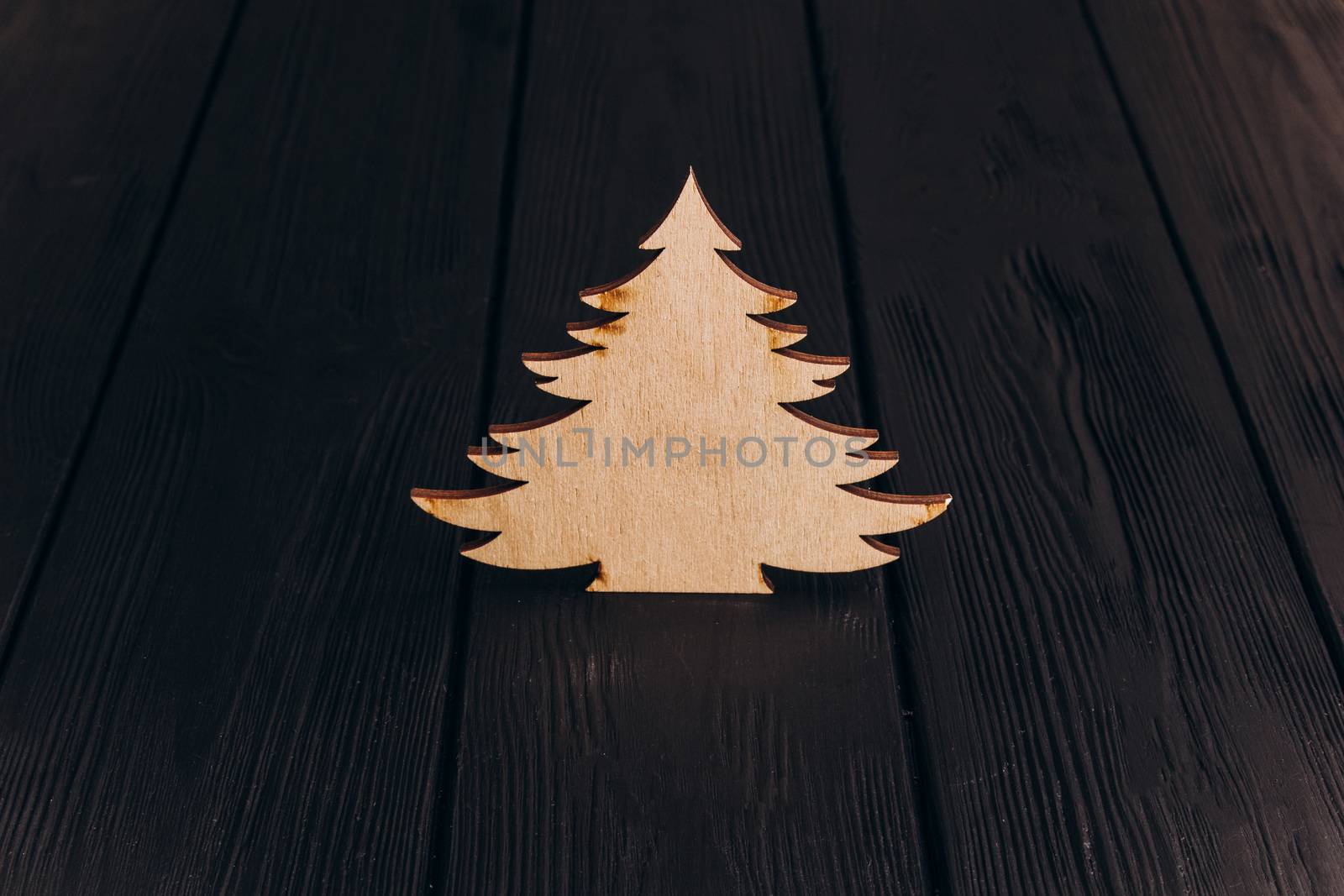 New Year composition with pine tree from plywood. Christmas background for presentation on wooden background holiday