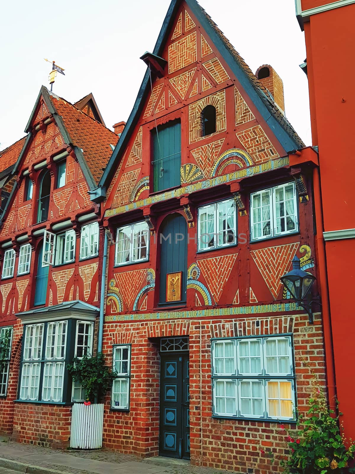 Half-timbered red brick houses near the river on the old harbor Lueneburg, Germany