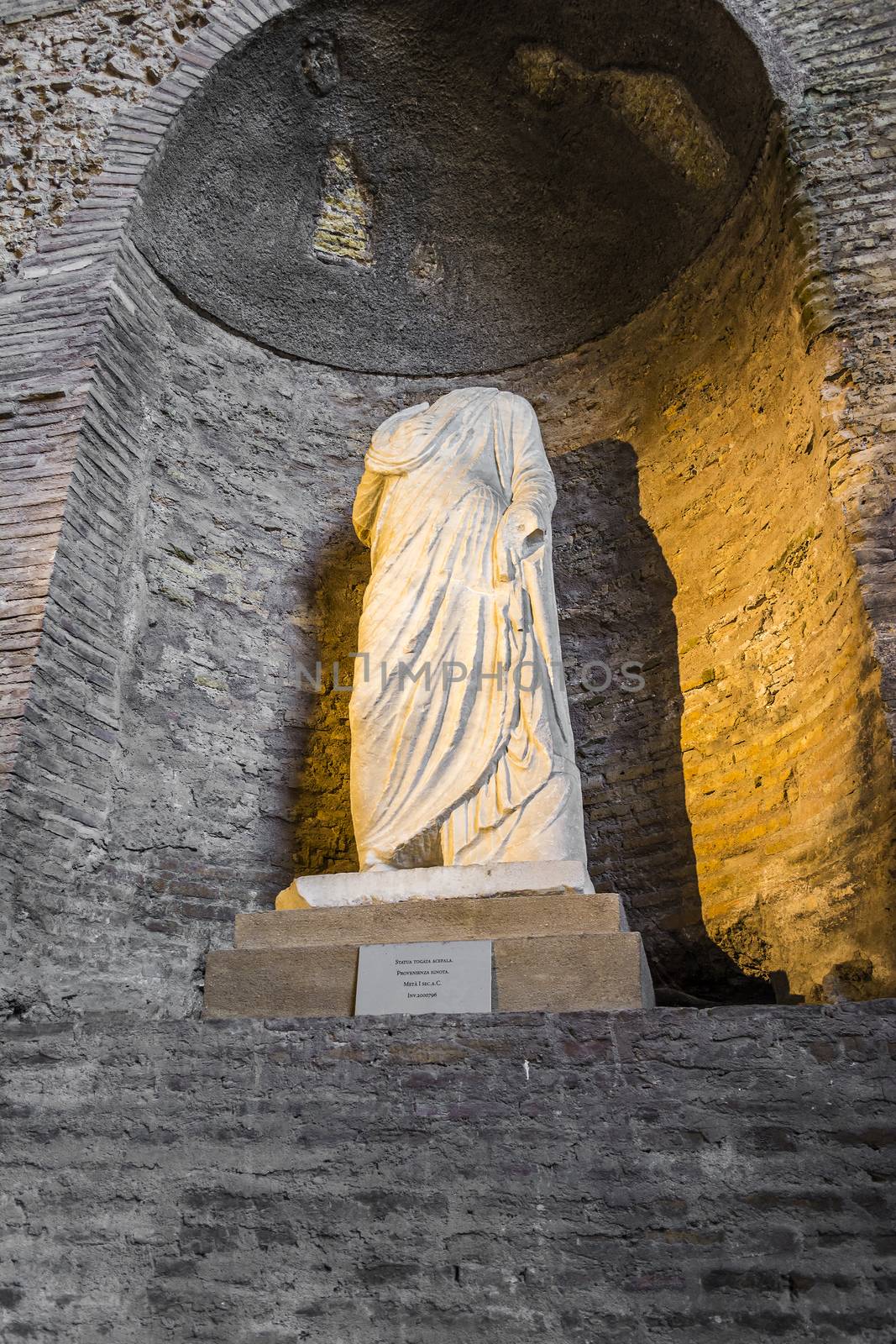 Rome, Italy - September 1, 2017: Ancient statue in baths of Diocletian (statua togata acefala) in Rome. Italy