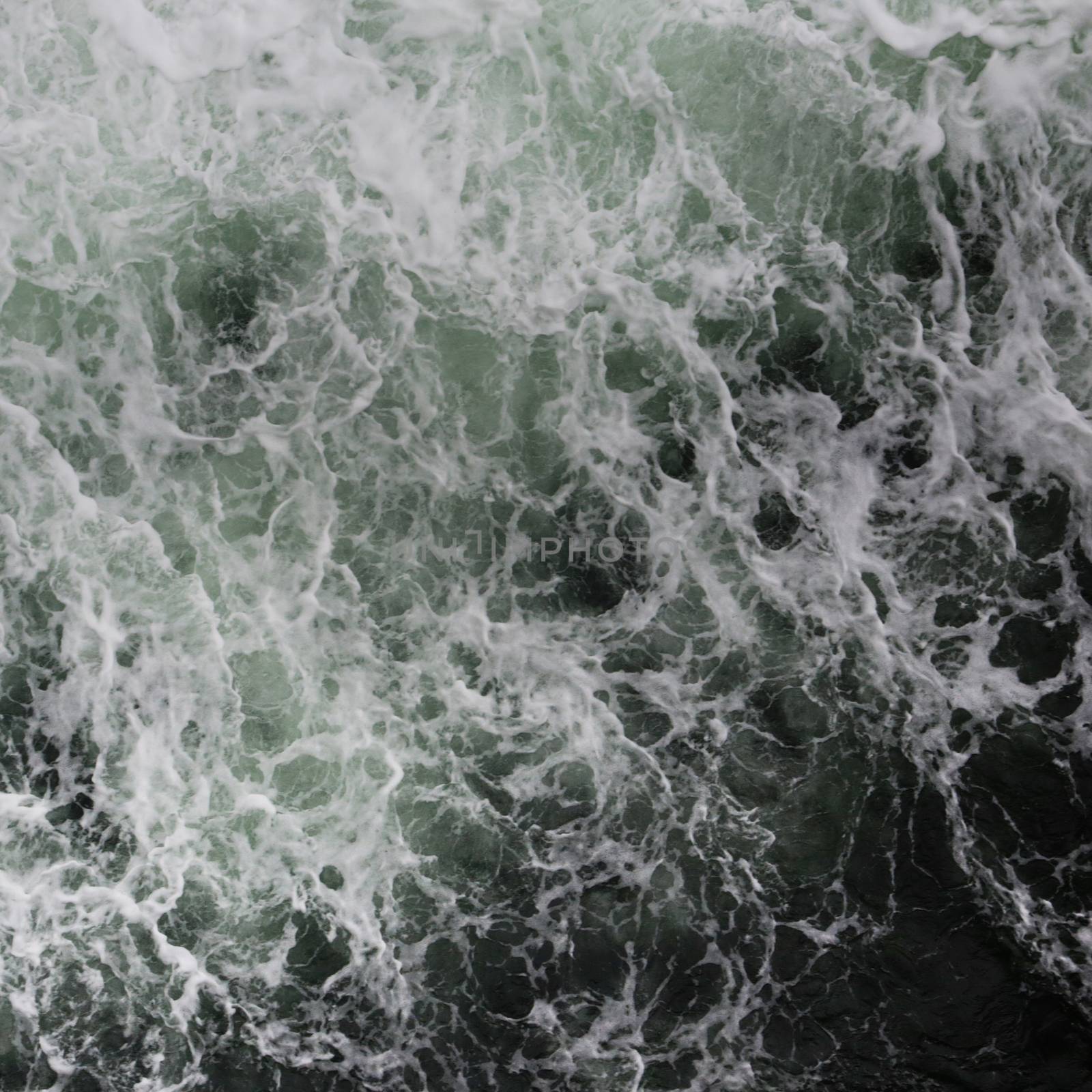 Big water splash seen from above a boat