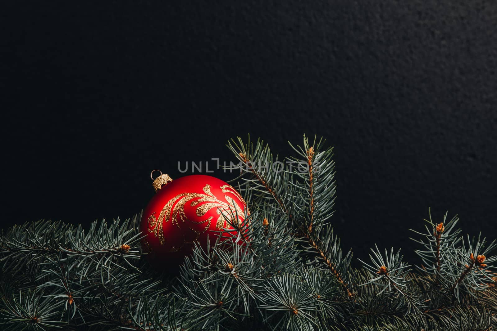 Christmas fir tree branches on wooden table. New year Christmas background with copy space. Greeting card.