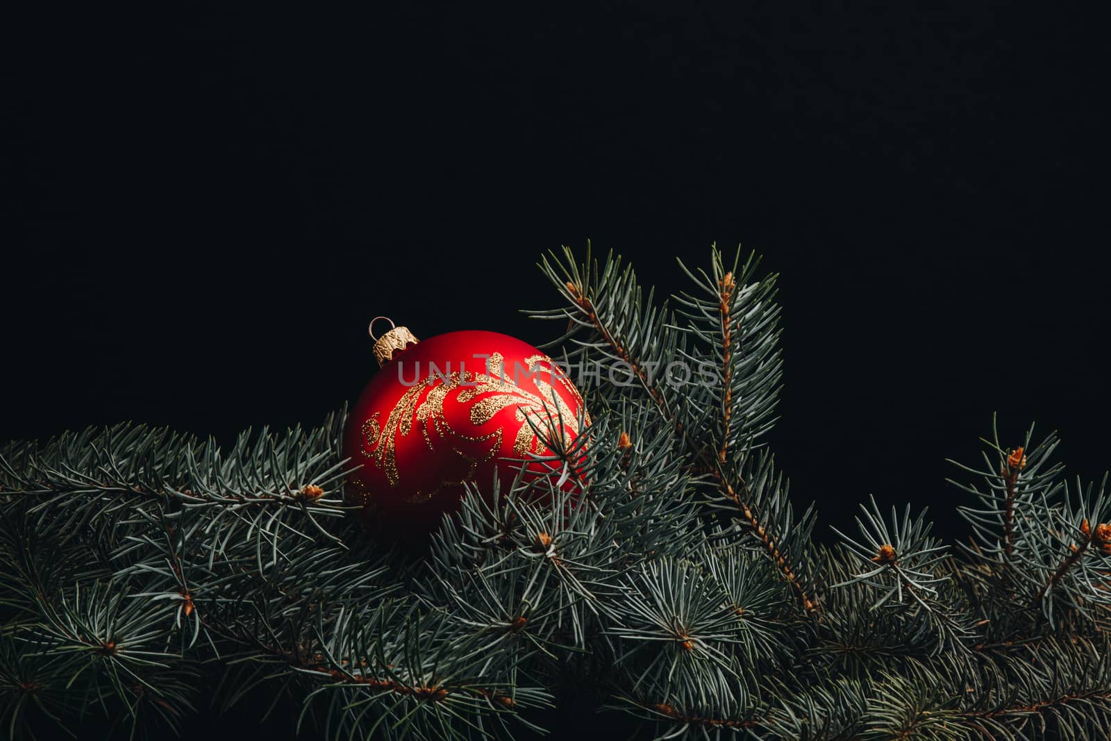 Christmas fir tree branches on wooden table. New year and Christmas background with copy space. Greeting card. by yulaphotographer