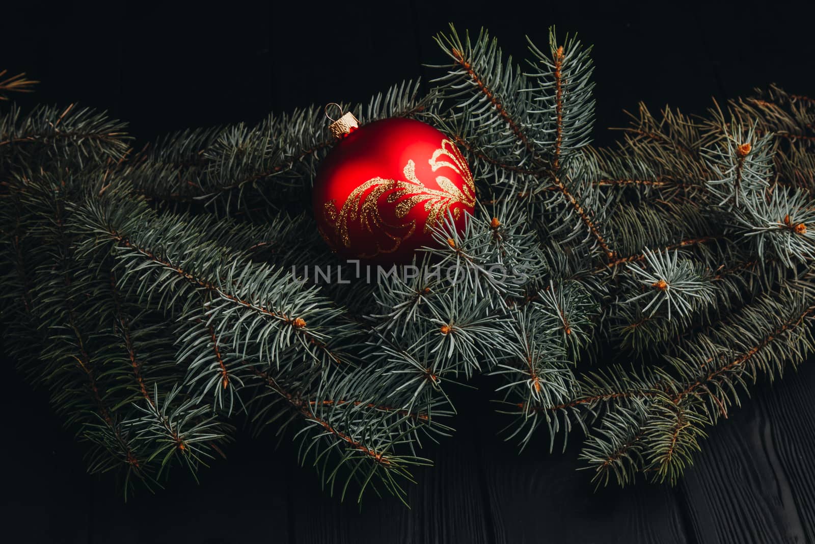 Christmas fir tree branches on wooden table. New year Christmas background with copy space. Greeting card.