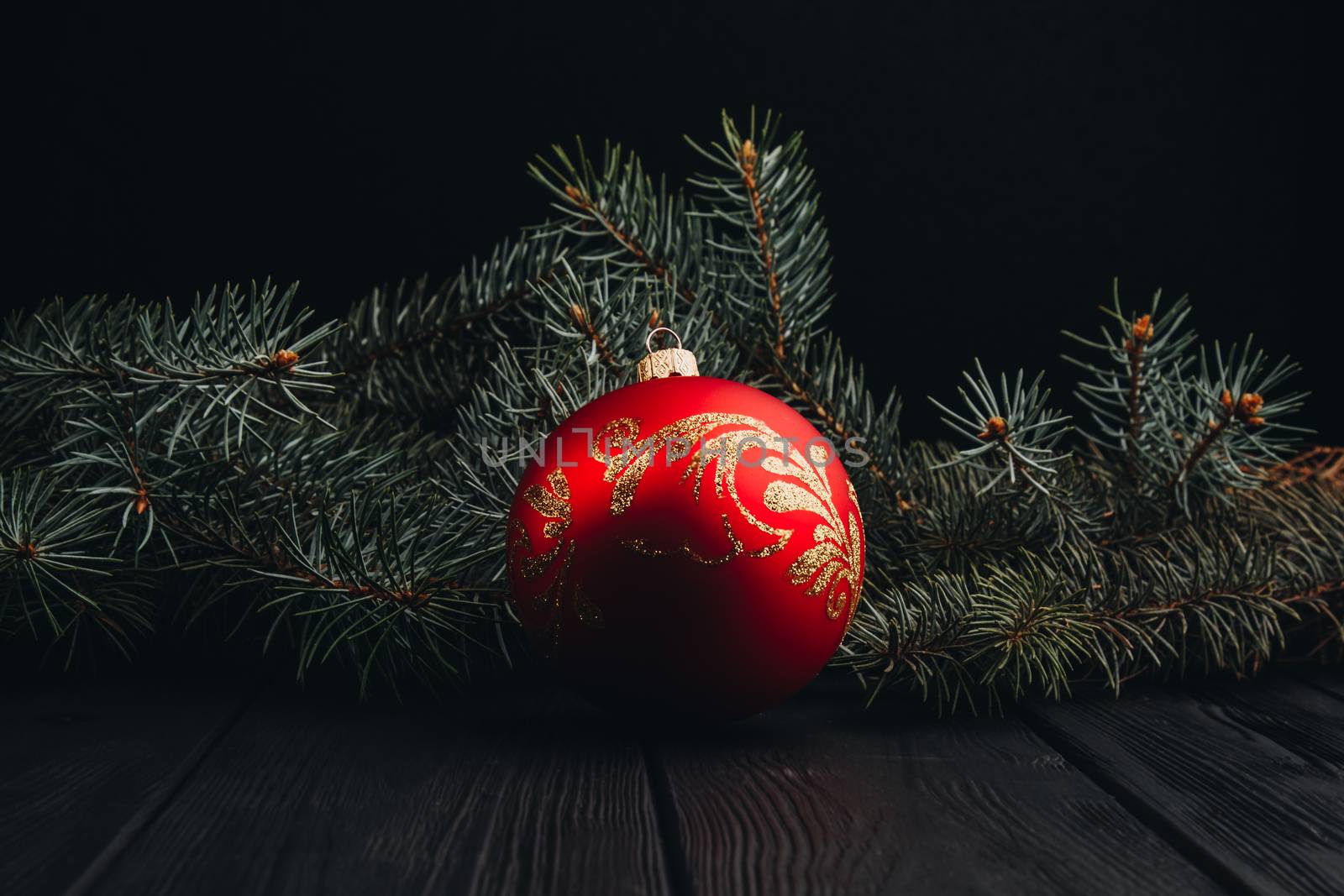 Christmas fir tree branches on wooden table. New year Christmas background with copy space. Greeting card.