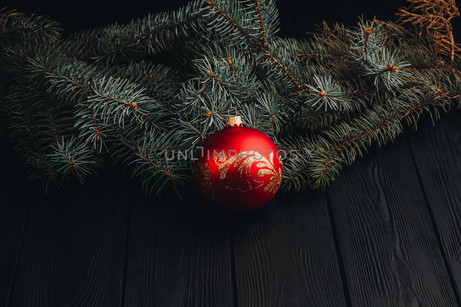 Christmas fir tree branches on wooden table. New year Christmas background with copy space. Greeting card.