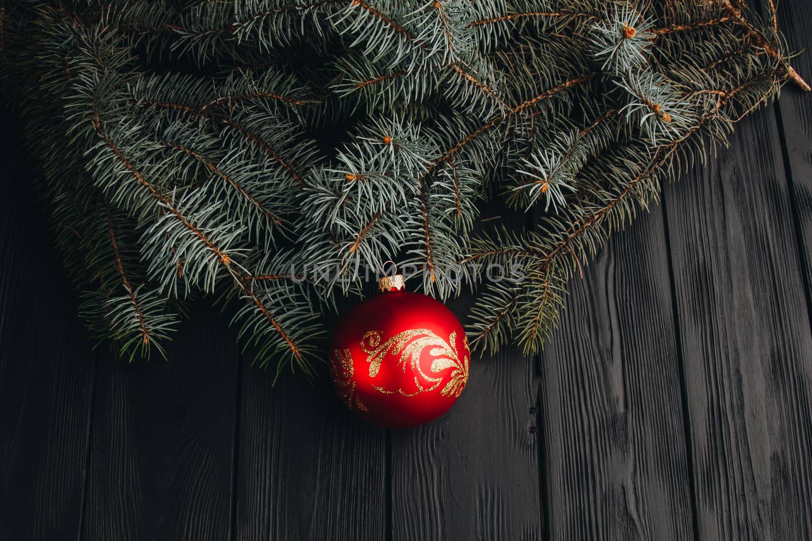 Christmas fir tree branches on wooden table. New year Christmas background with copy space. Greeting card.