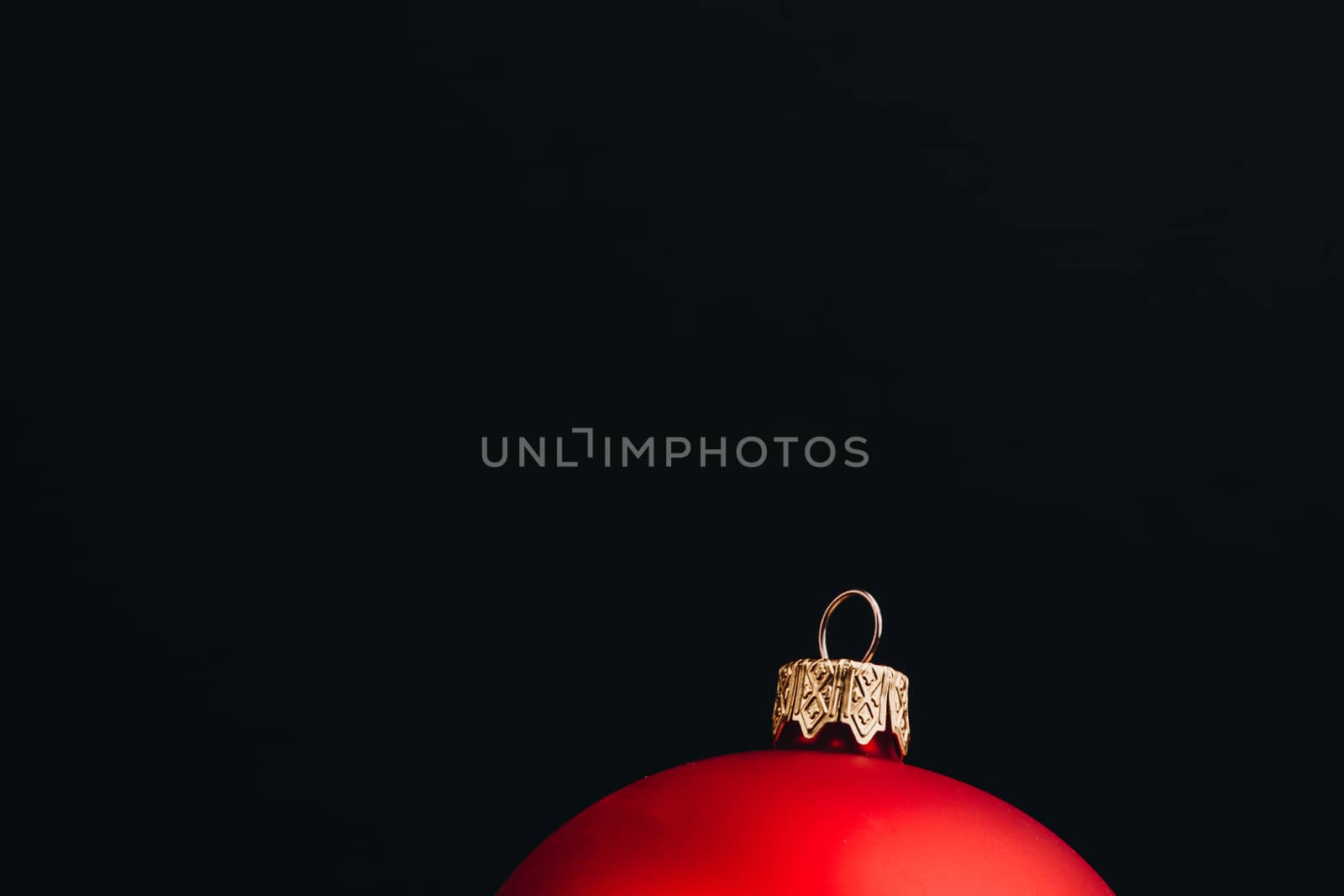 Christmas New Year decoration composition. Top view of fur-tree branches and balls frame on wooden background with place for your text.