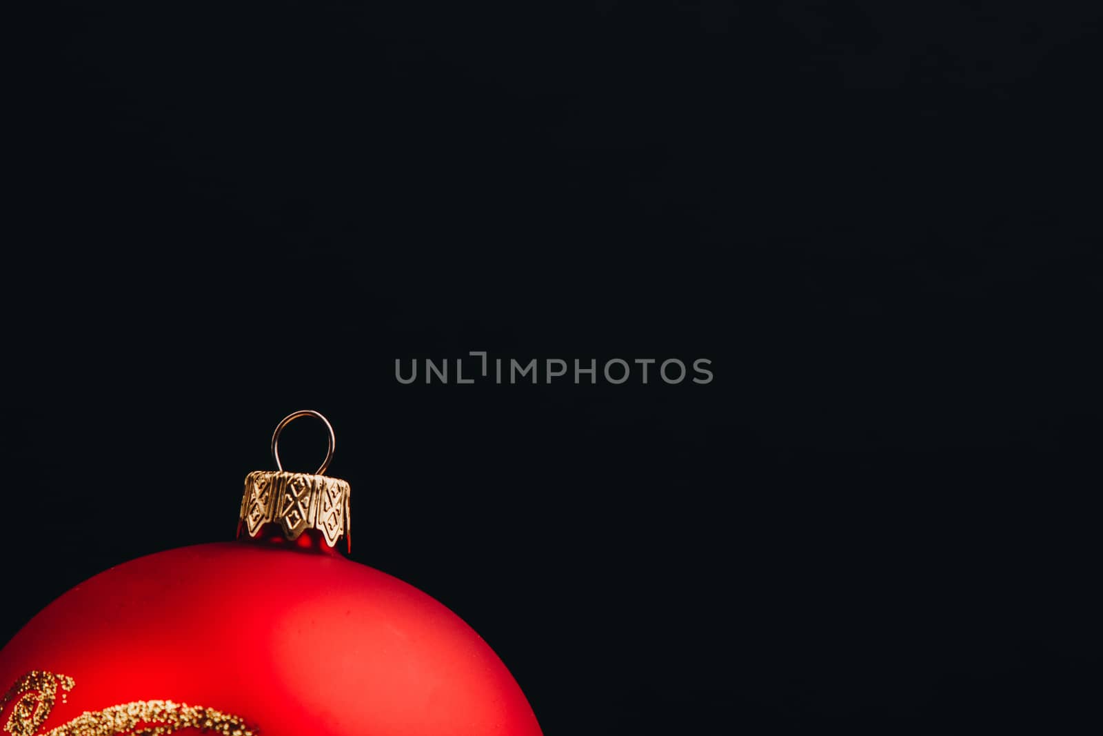 Christmas New Year decoration composition. Top view of fur-tree branches and balls frame on wooden background with place for your text.