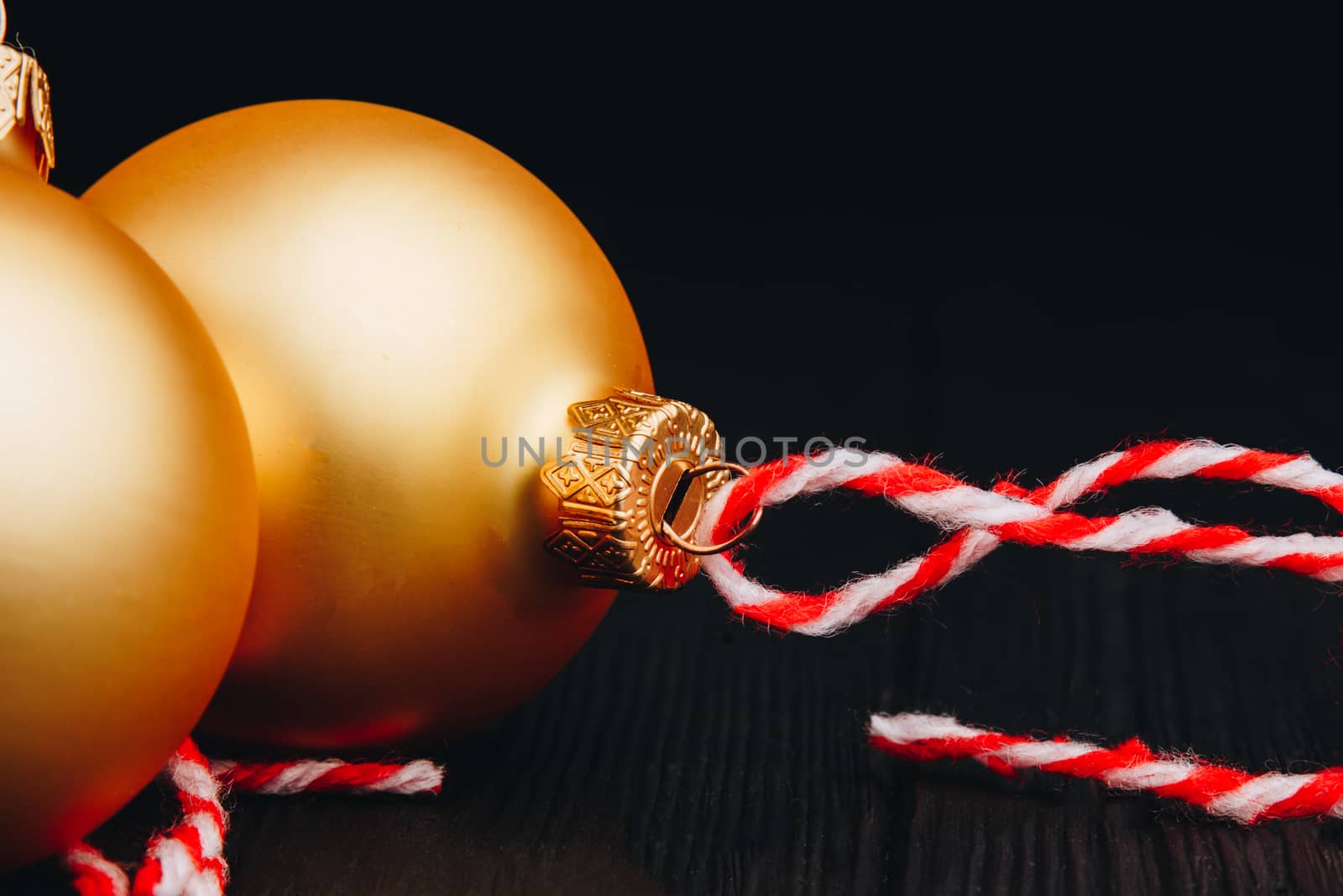 Colored christmas decorations on black wooden table. Xmas balls on wooden background. Top view, copy space. new year by yulaphotographer