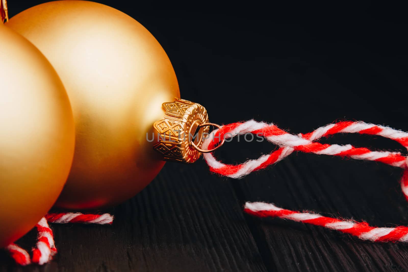 Colored christmas decorations on black wooden table. Xmas balls on wood background. Top view, copy space. new year