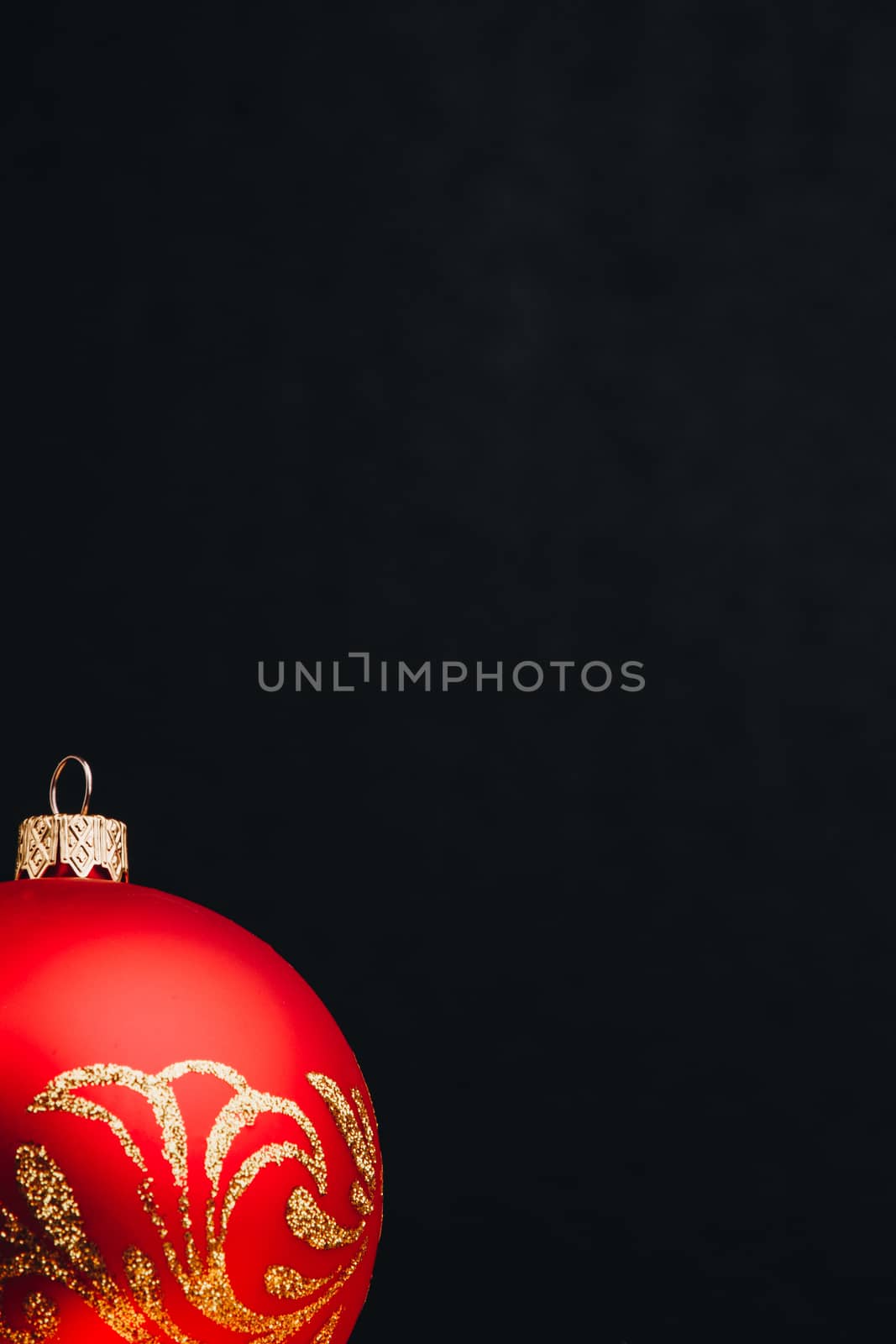 Colored christmas decorations on black wooden table. Xmas balls on wooden background. Top view, copy space. new year by yulaphotographer