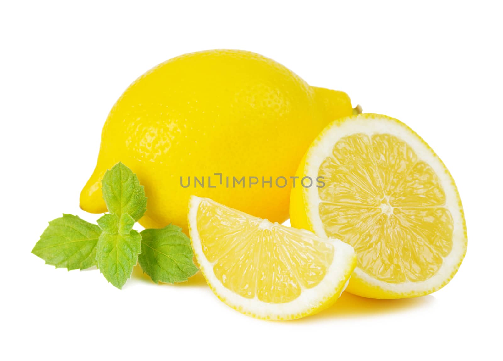 Juicy yellow cut lemon and green leaves of fresh mint isolated on white background
