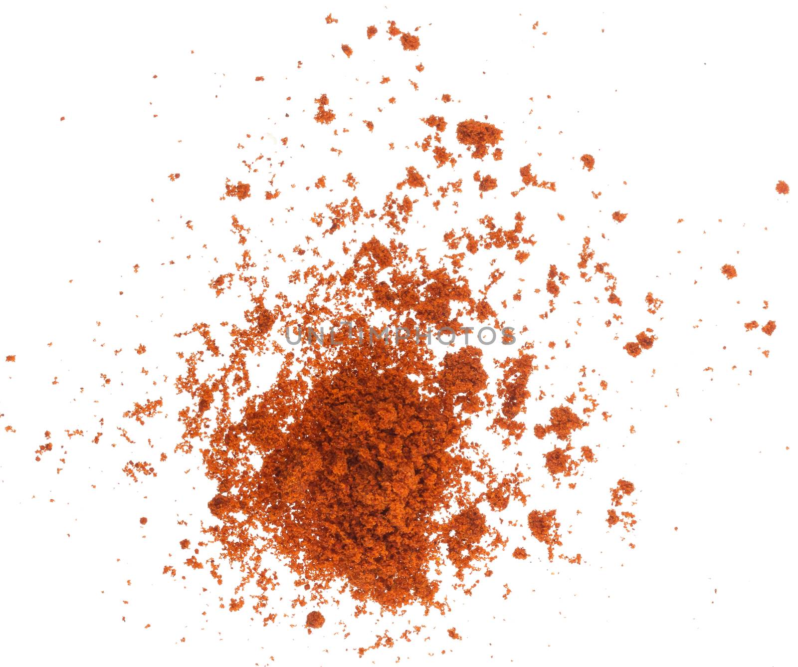 Scattered red paprika powder isolated on white background, top view