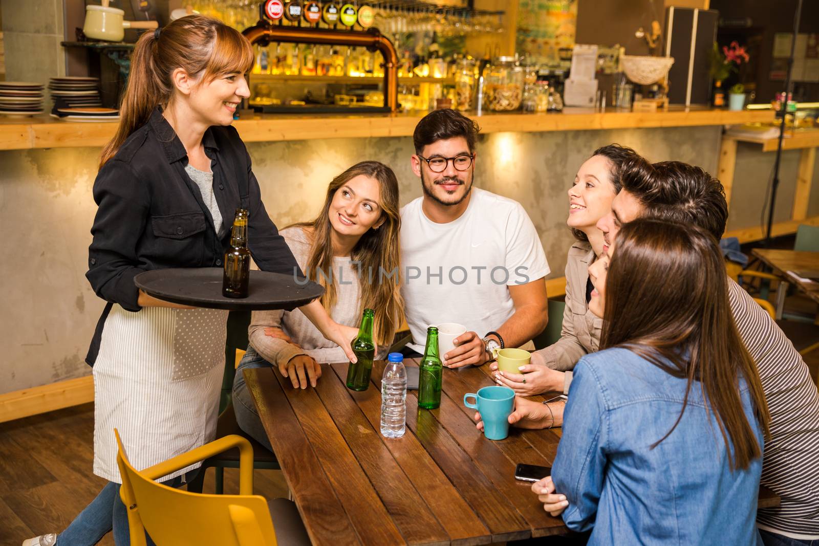 A group of friends making a order at cafe 