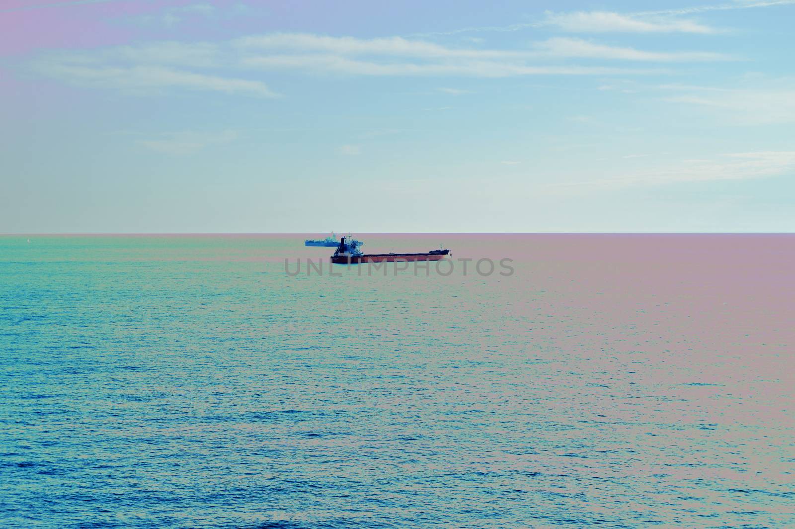 Fantasy effect of Sunset over the Mediterranean sea, view of the ships.