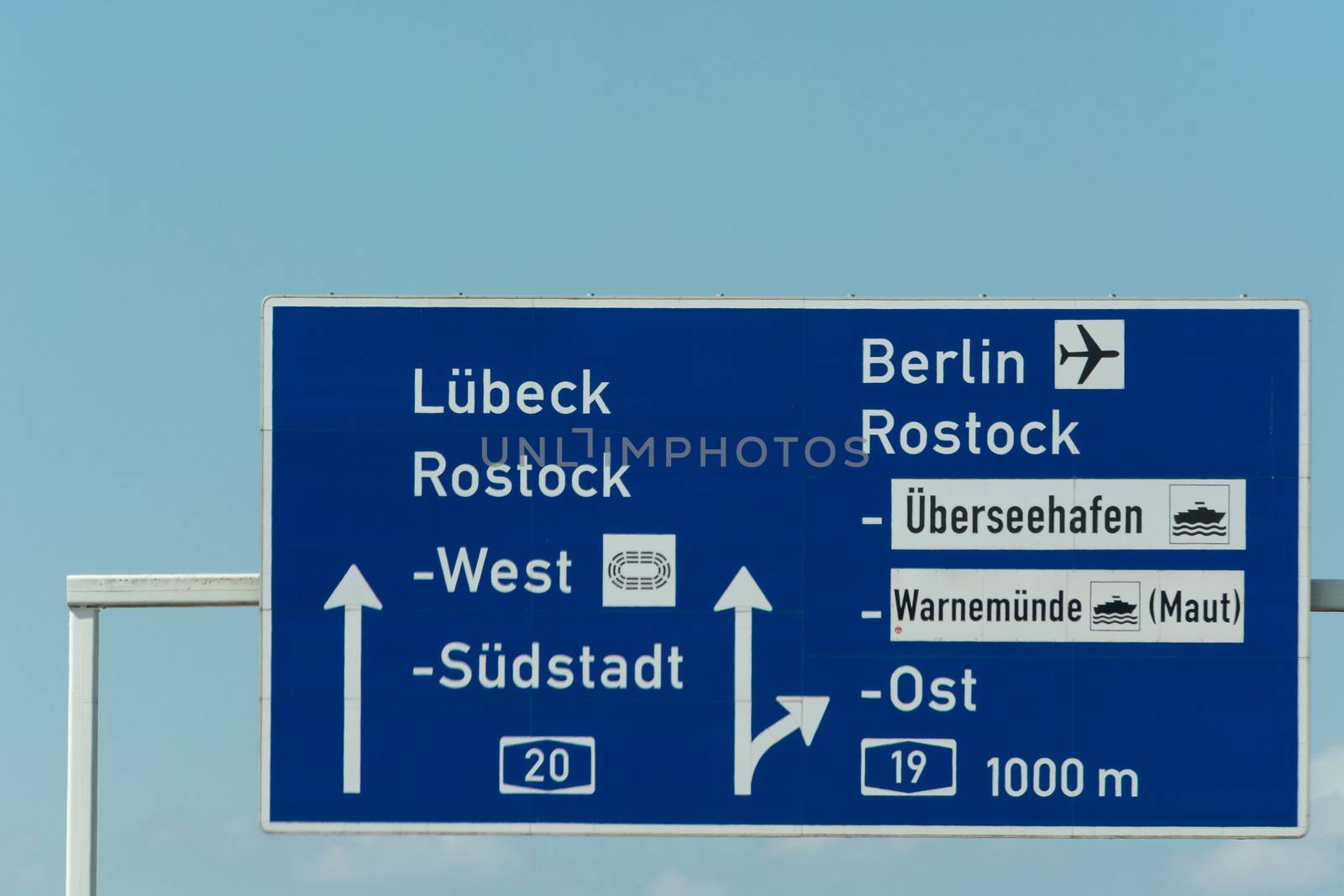 Autobahn sign in Germany Caption on German - city names Berlin,Berlin Airport, Rostock, Lübeck