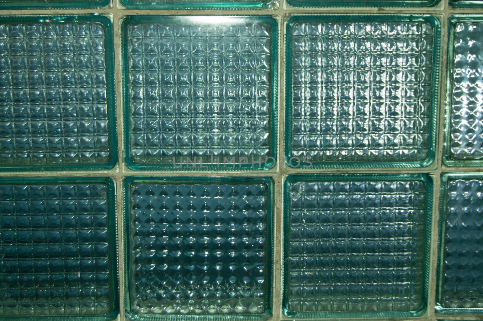BACKGROUND TEXTURE OF GLASS TRANSPARENT SQUARE TILES.