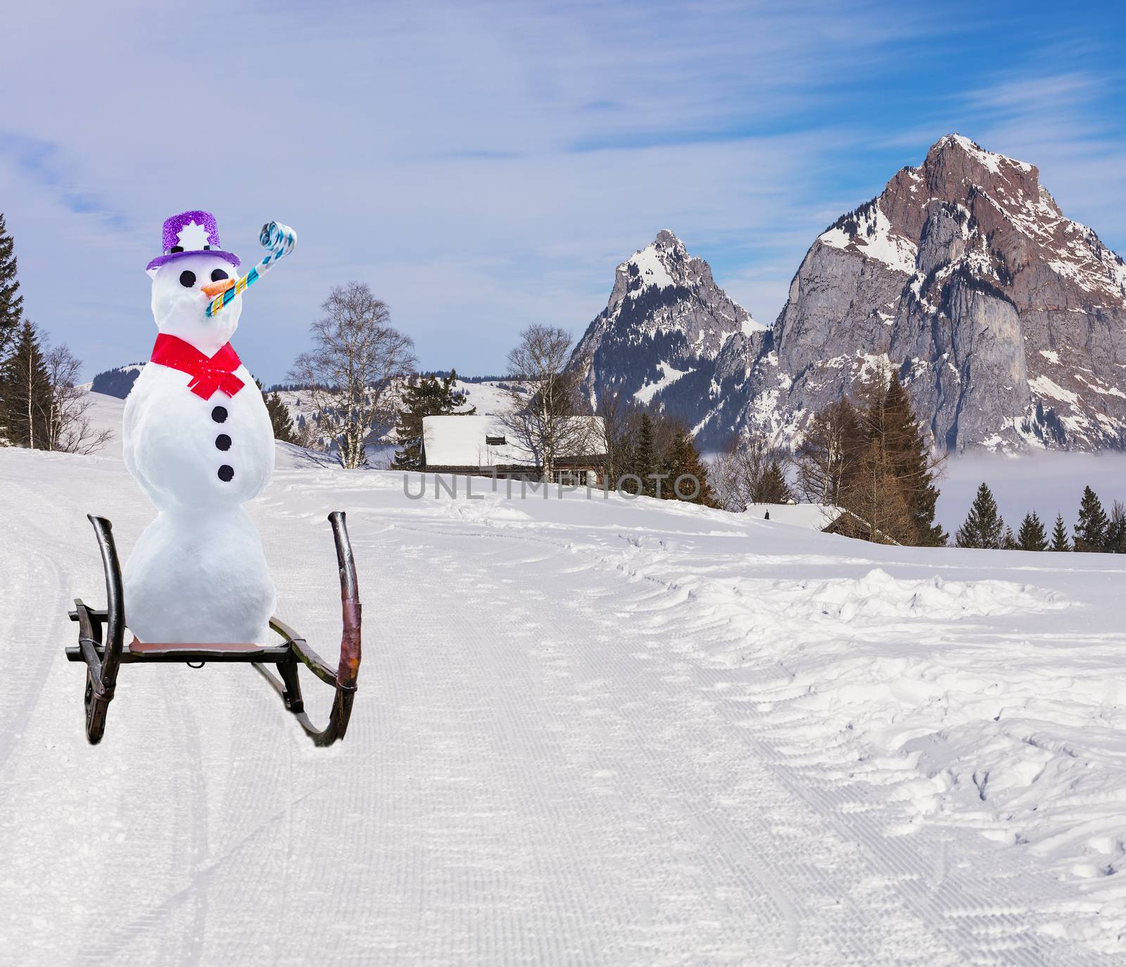 funny christmas concept of a party snowman wearing a hat and roller tongue sliding down the ski hill slope on a sleigh