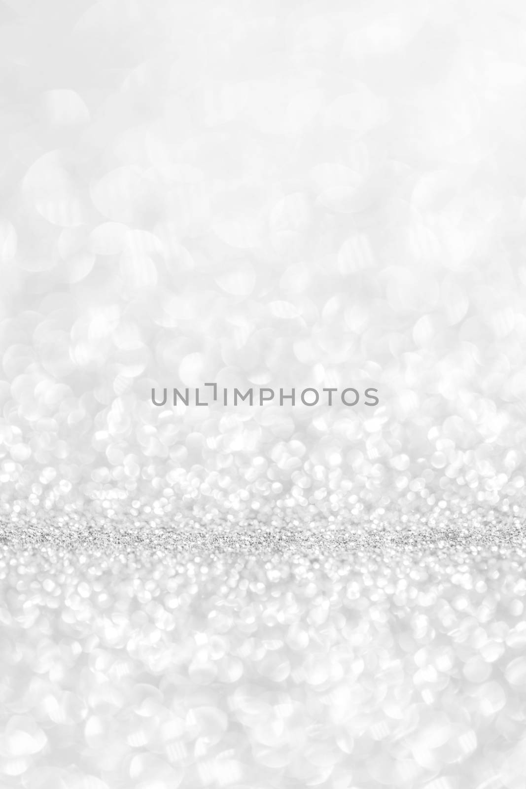 Abstract shining glitters silver holiday bokeh background with copy space for text