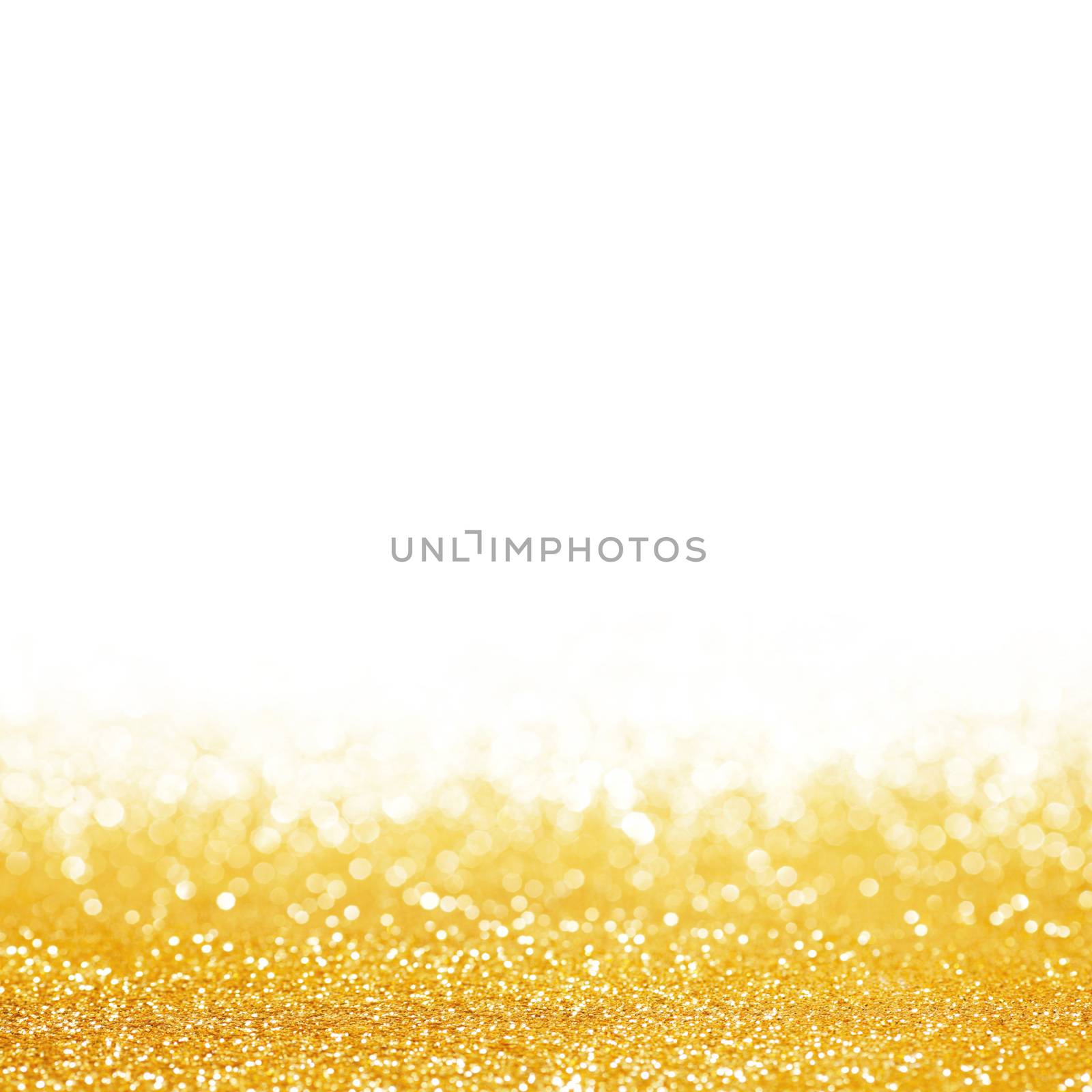 Golden festive glitter background with defocused lights