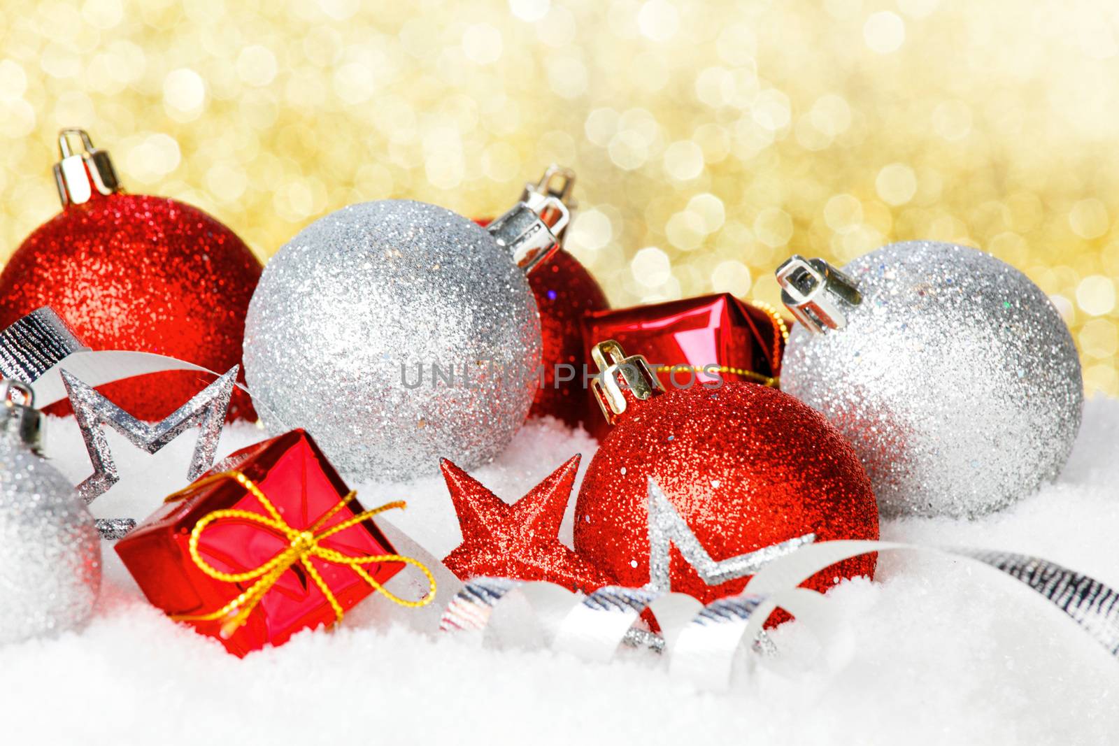 Christmas card with beautiful decorations in snow on golden background
