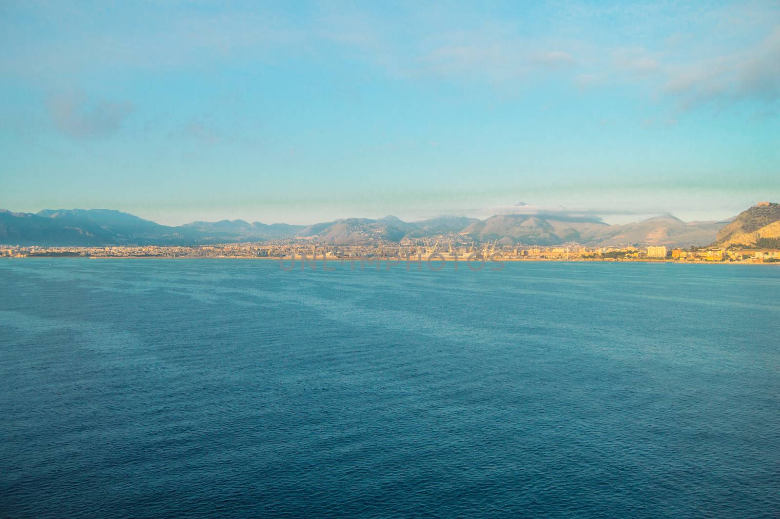 Beautiful sunrise over Palermo, panorama of the city from the sea.