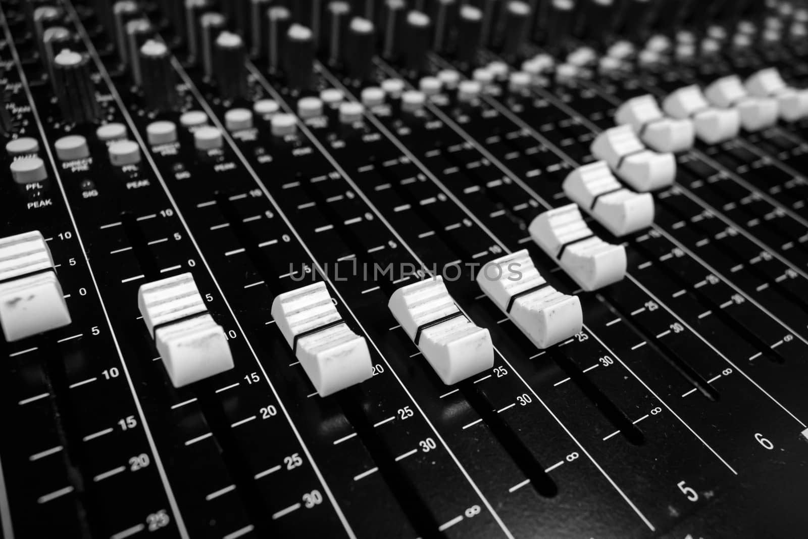 Closeup Professional Audio Mixing Console Faders by ernest_davies
