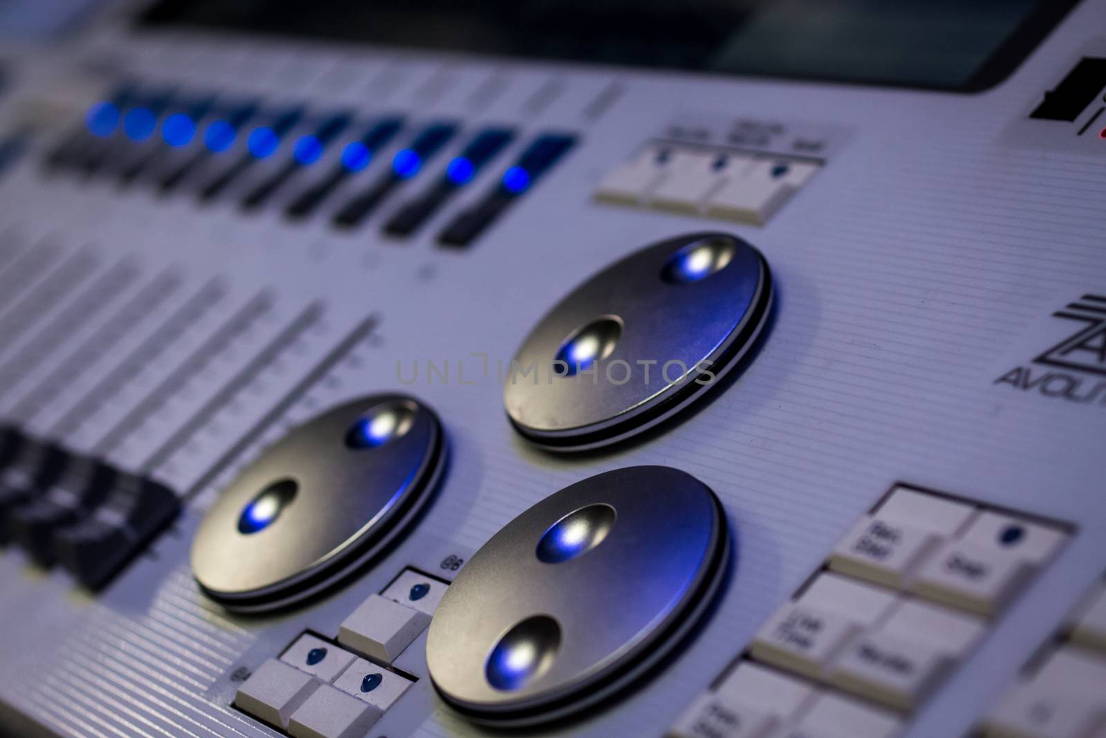 Silver digital encoders and Faders on white pro Lighting Designers festival Console