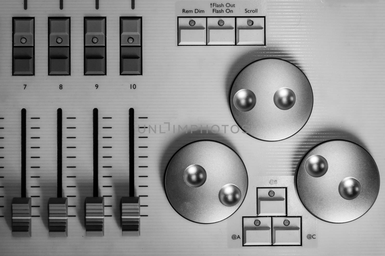 Silver digital encoders and Faders on white pro Lighting Designers festival Console