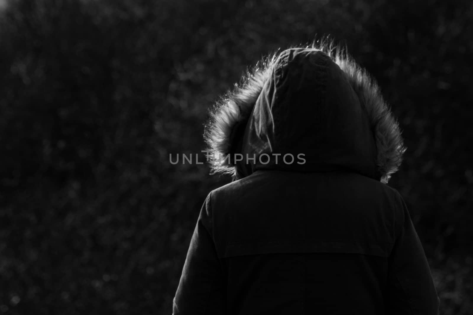 Girl Wearing Fur Hooded Parker Jacket From Behind woodland background