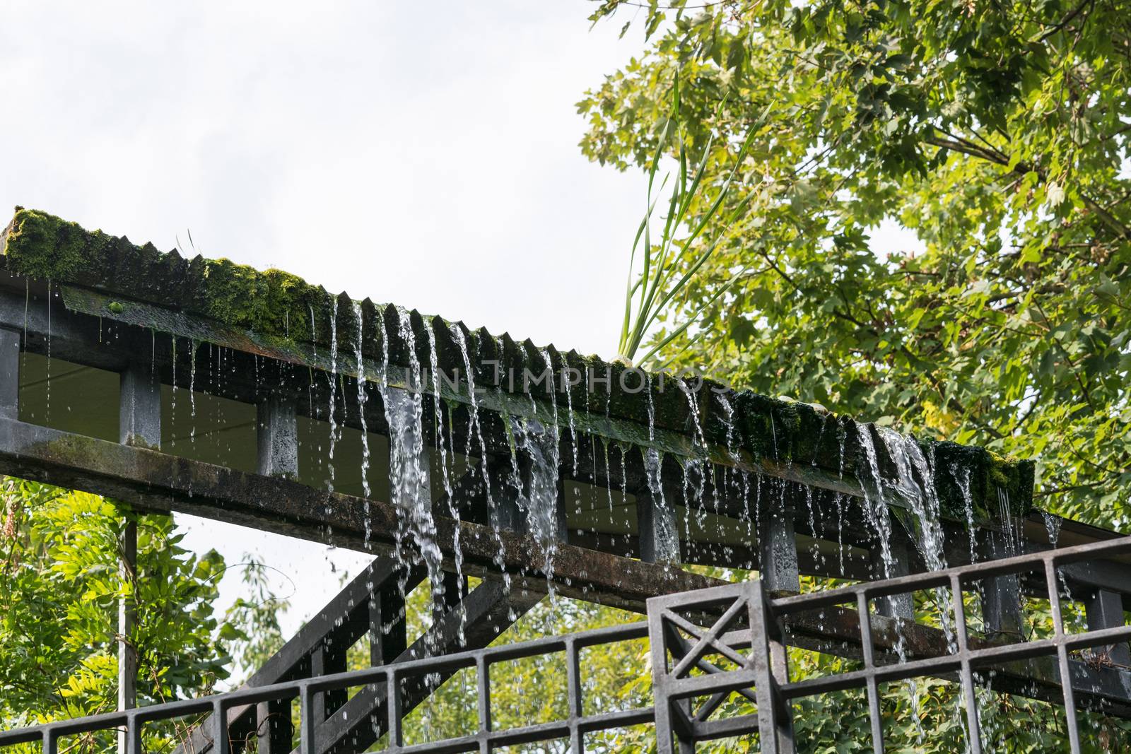 Small weir waterfall in a public park