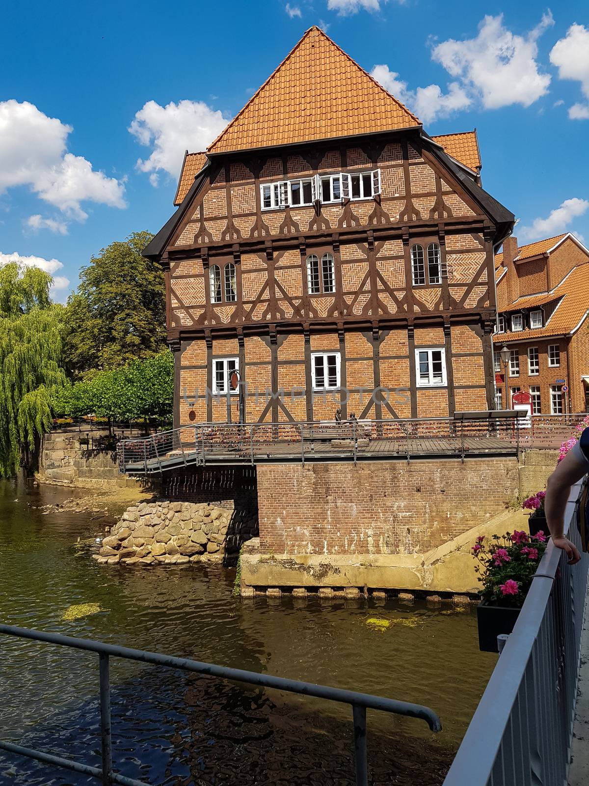 Half-timbered red brick houses near the river on the old harbor Lueneburg, Germany