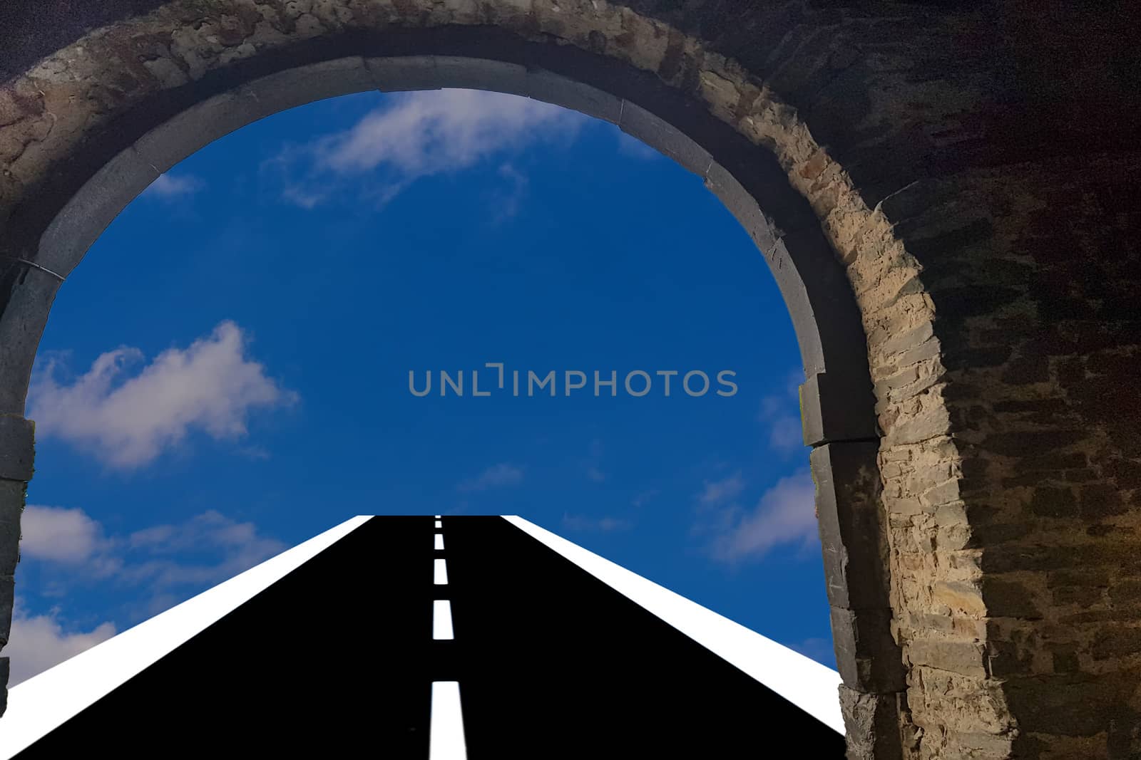 View through a door arch. Asphalt road leads into the blue cloudy sky  Background