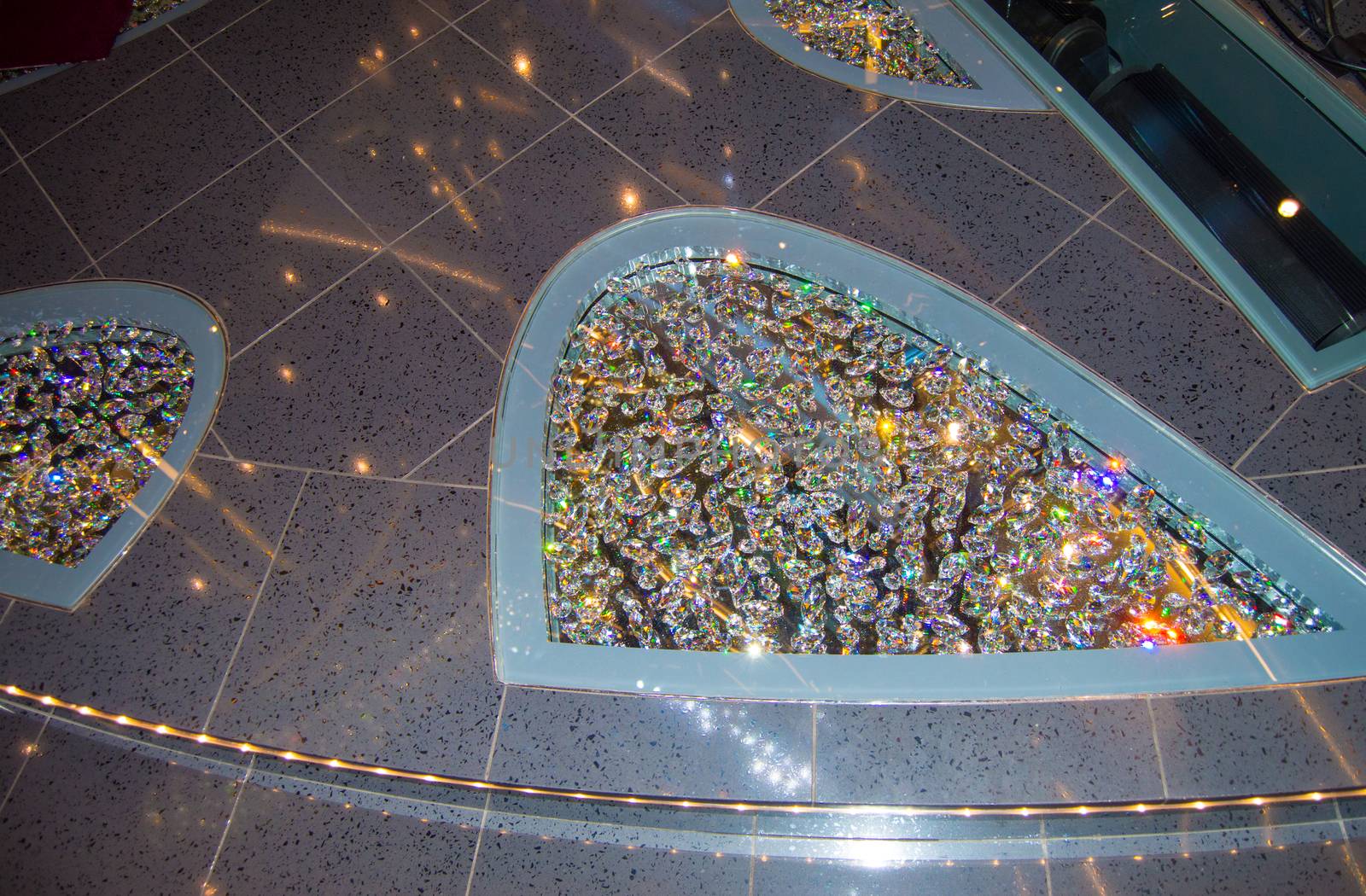 Shiny rhinestones decorations on the floor of the cruise ship. Mirror Shine background.