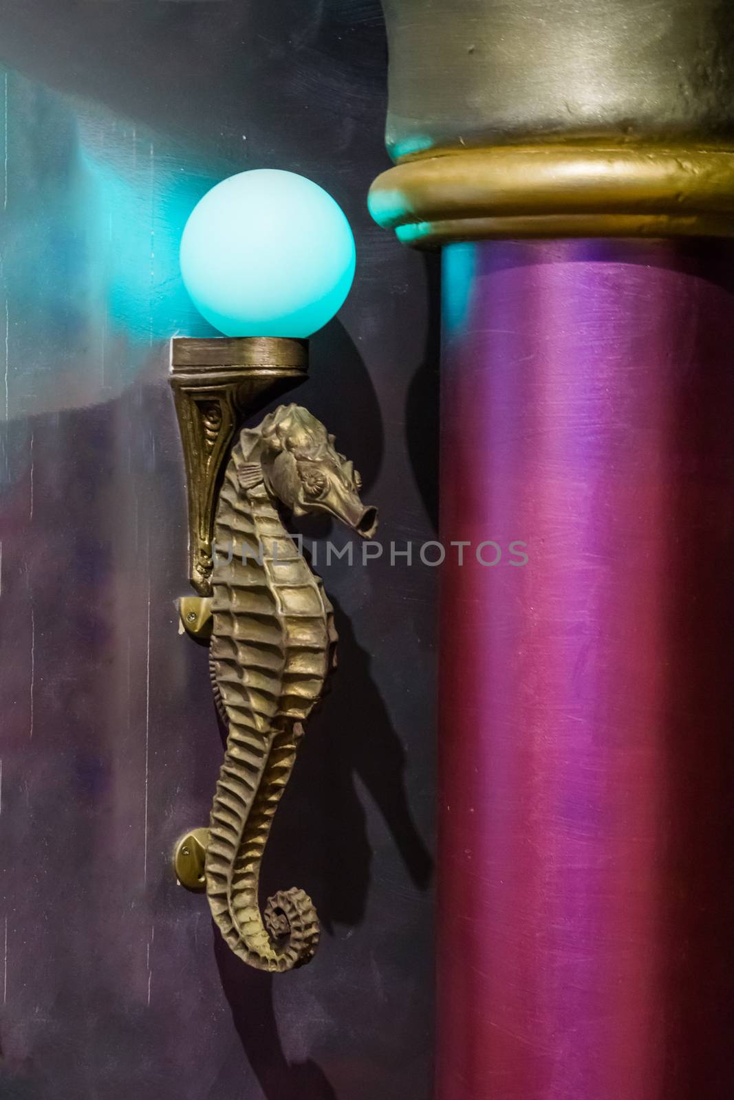 golden antique seahorse marine life animal sculpture lamp with a blue light bulb